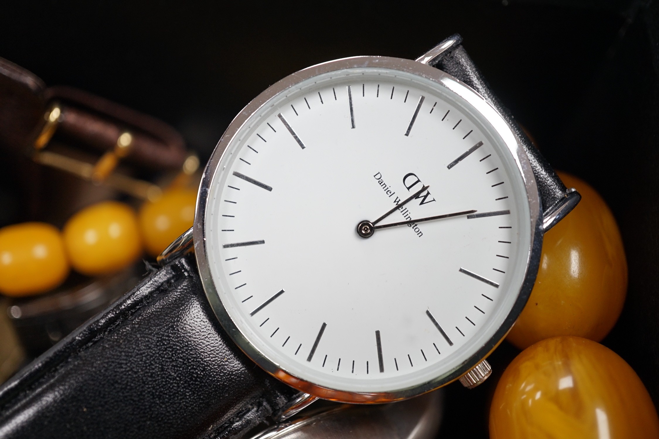 A quantity of assorted gentleman's modern wrist watches and two necklaces including amber style.